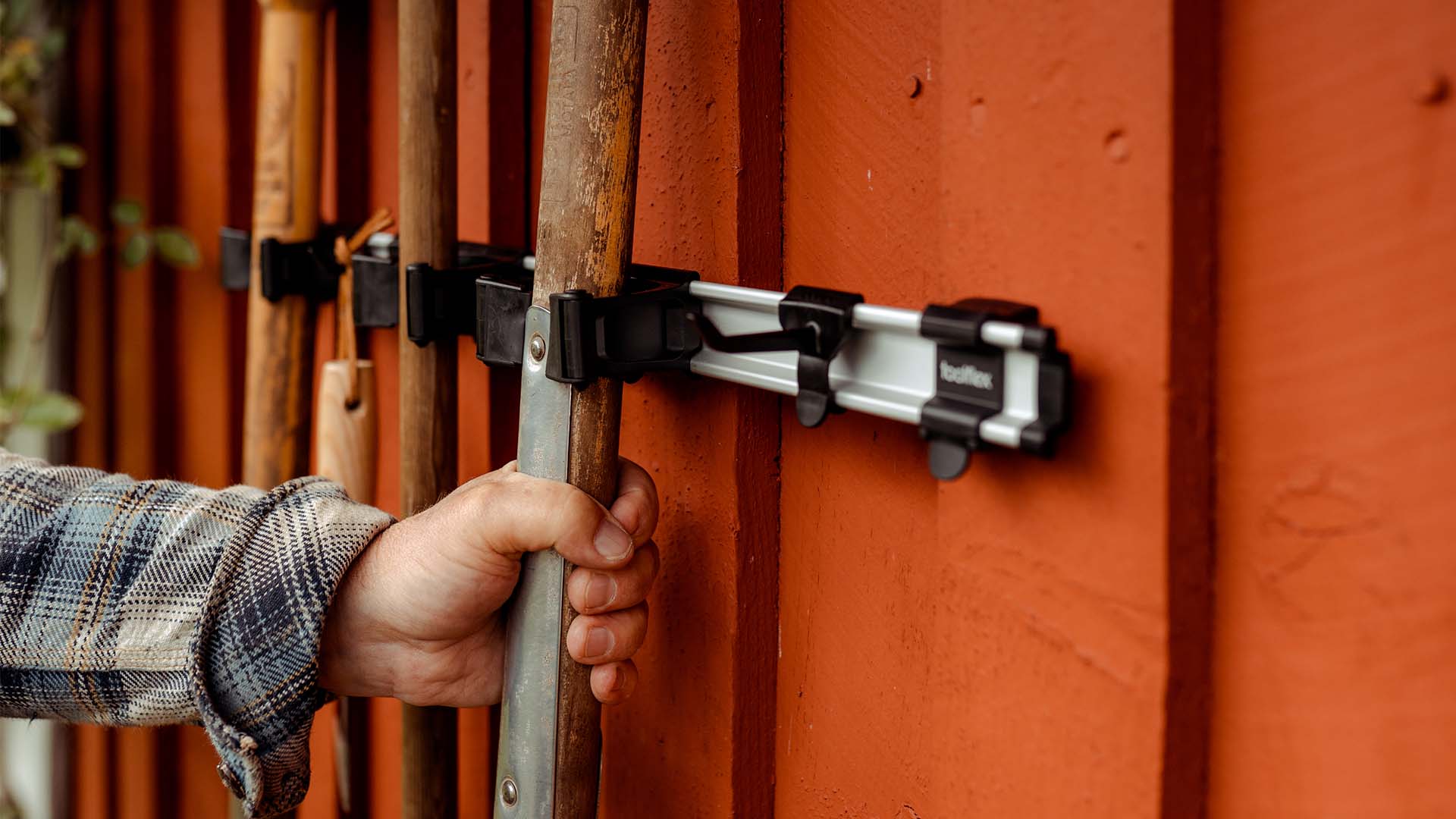 Toolflex holder - Man taking shovel from Toolflex holder